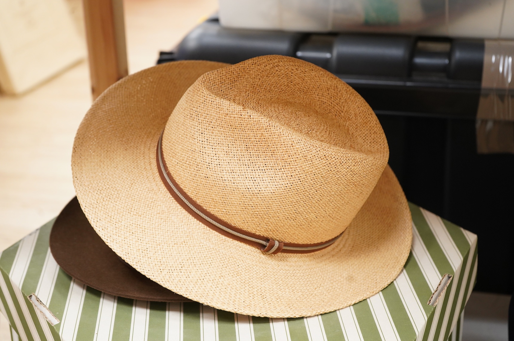 Two hat boxes containing five gentleman's hats; three Fedoras by Locke, Christy’s and Herbert Johnson and two straw Panamas, one by Bates.